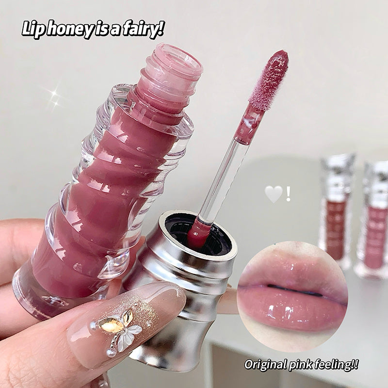 Pink lip gloss with applicator and close-up of lips wearing the color, labeled 'Liphoney is a fairy!'.