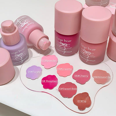Makeup products including bottles and blush shades on a white background