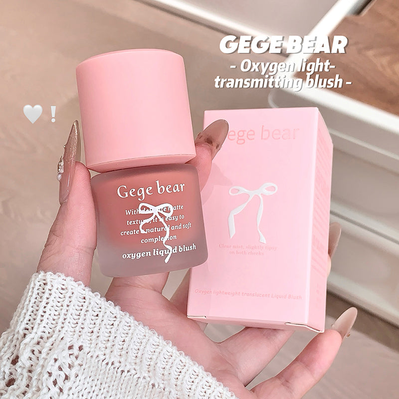 Pink Gege Bear oxygen light-transmitting blush with packaging held in a hand.