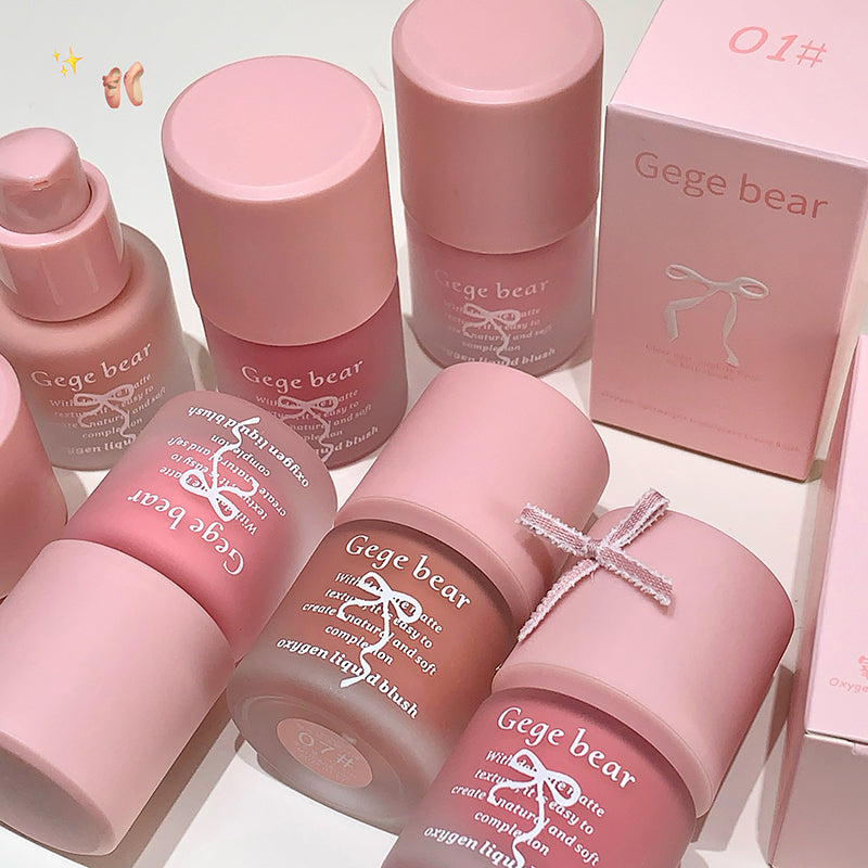 Collection of pink Gege bear skincare products with packaging on a light background