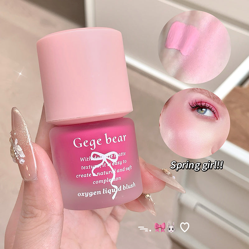 Pink nail polish bottle with 'Gege bear' branding, held by a hand, with close-up of nail color and eye makeup.