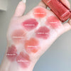 Hand with lipstick swatches labeled with color names and a lipstick held above.