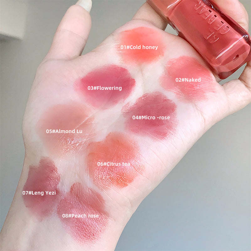 Hand with lipstick swatches labeled with color names and a lipstick held above.