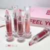 Set of pink lip glosses with clear applicators on a white background, featuring the brand 'GEEGER'.
