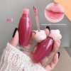 Pink lip gloss with applicator held in hand, close-up of lips with text 'Korean sweet and tender feeling!'.