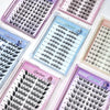 Multiple trays of false eyelashes with colorful packaging on a white background