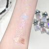Color samples on a arm with small bottles in the background