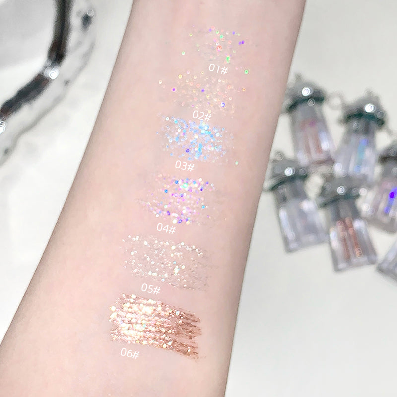 Color samples on a arm with small bottles in the background