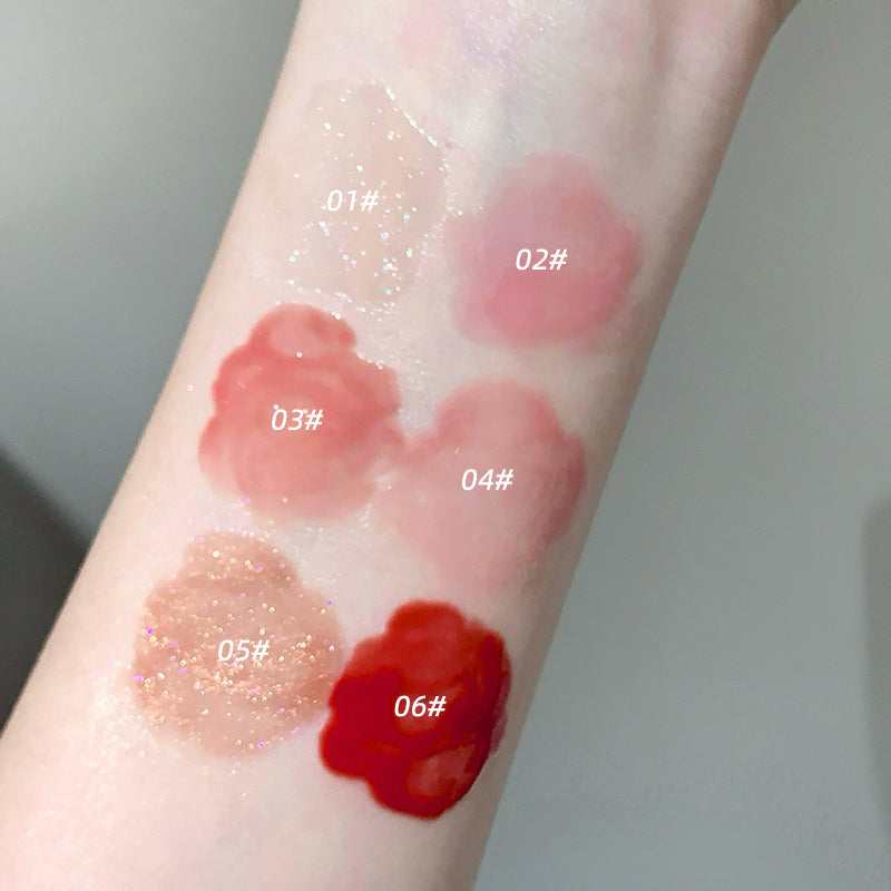 Color swatches of lipsticks on a person's arm with labeled colors.