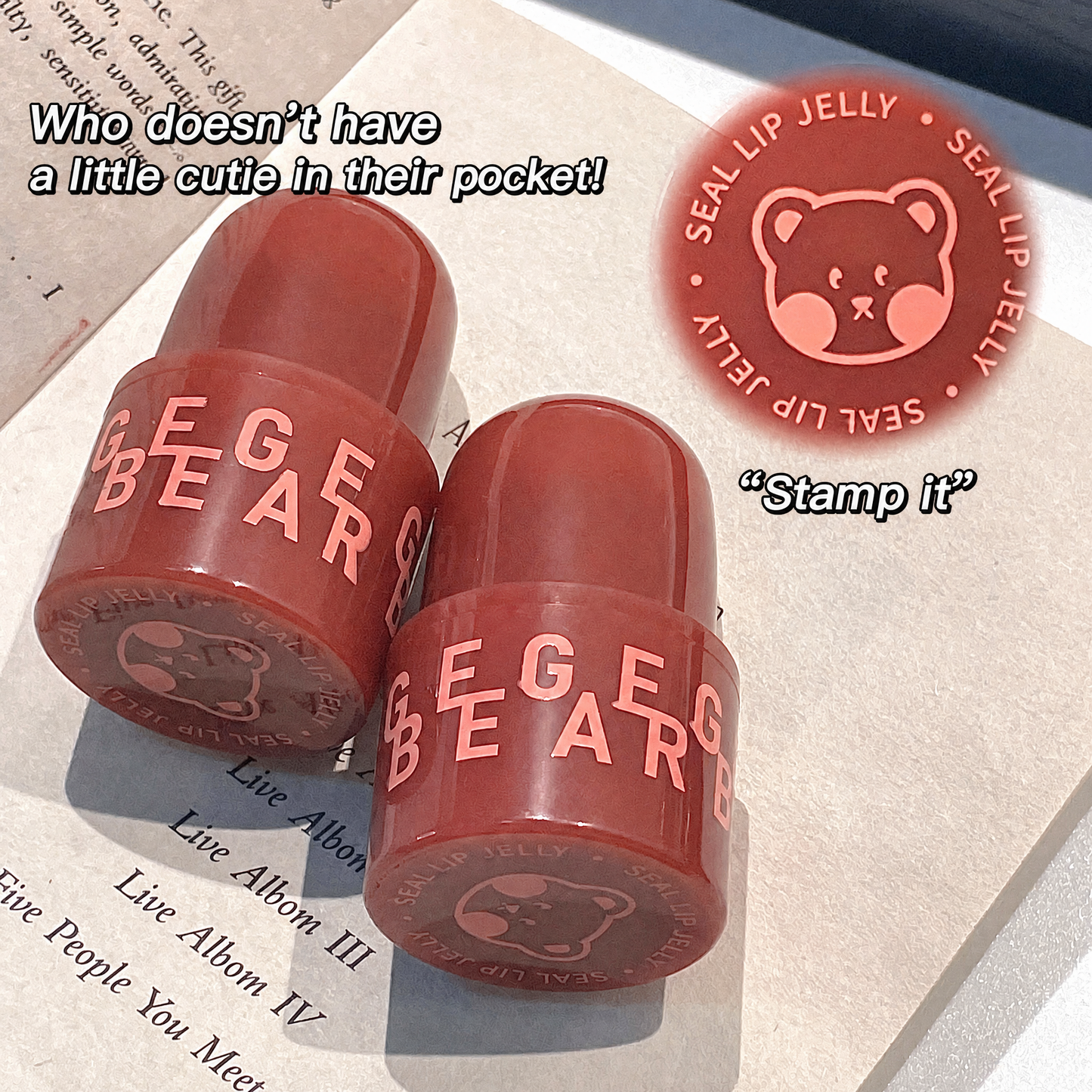 Two red lip jelly products with 'GEGE BEAR' branding on a surface.