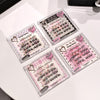 Four packages of false eyelashes with pink and white packaging on a white surface.