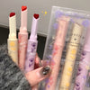Set of lipsticks with visible branding and packaging details.