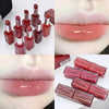 Collage of red lipsticks and lip glosses with close-up shots of lips wearing them.
