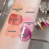 Lipstick swatches on a person's arm with labeled colors.