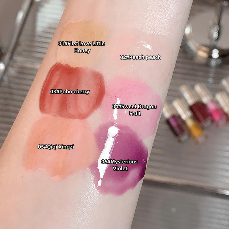Lipstick swatches on a person's arm with labeled colors.