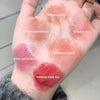 Color swatches on a person's wrist with labeled shades of lipstick.