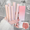 Set of lip products including lipsticks and a gloss with a hand holding them.