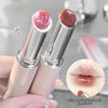 Two lipsticks with close-up of lips wearing the color on a mirror background