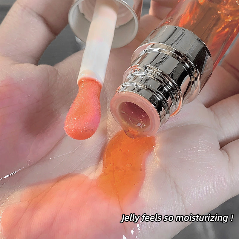 Close-up of a hand holding a lip balm with jelly-like texture, labeled 'Jelly feels so moisturizing!'.