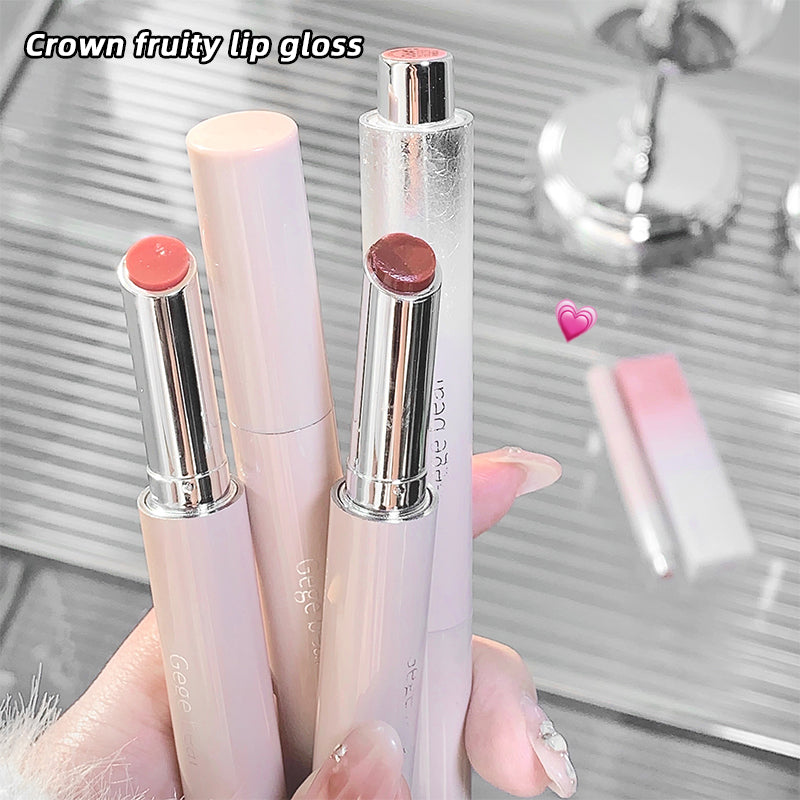 Three lip products with 'Crown' branding on a reflective surface.