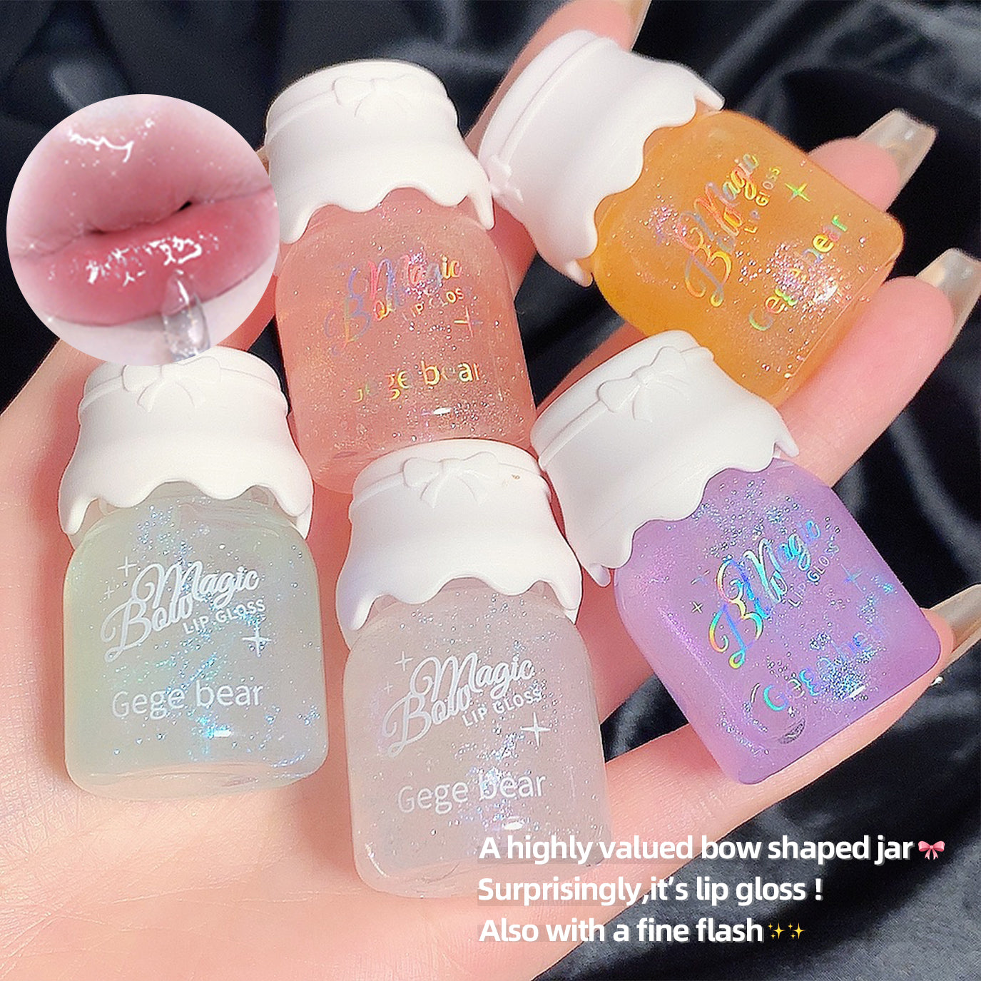 Set of lip gloss bottles with colorful caps held in a hand.