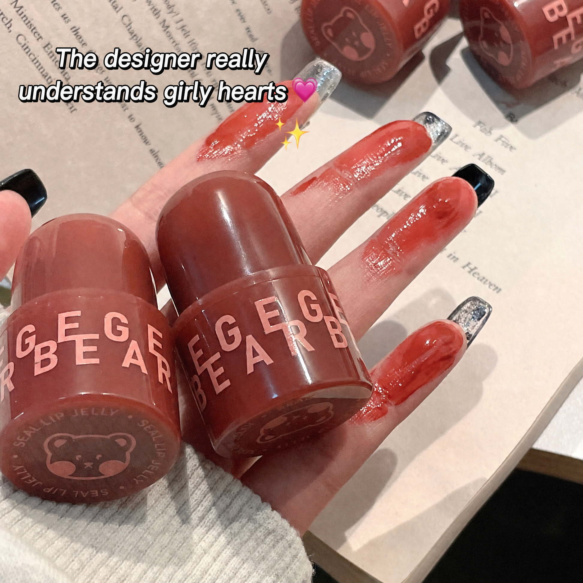 Hand holding GEGER BEAR lip products with text overlay