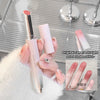 Lipstick held by a hand with a blurred background