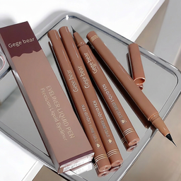 Gege bear eyeliner liquid pens on a reflective surface with packaging.