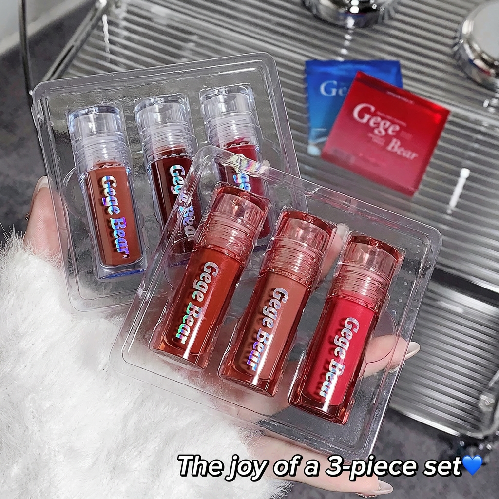Set of red lip glosses in clear packaging with 'Gege Bear' branding, held by a person.